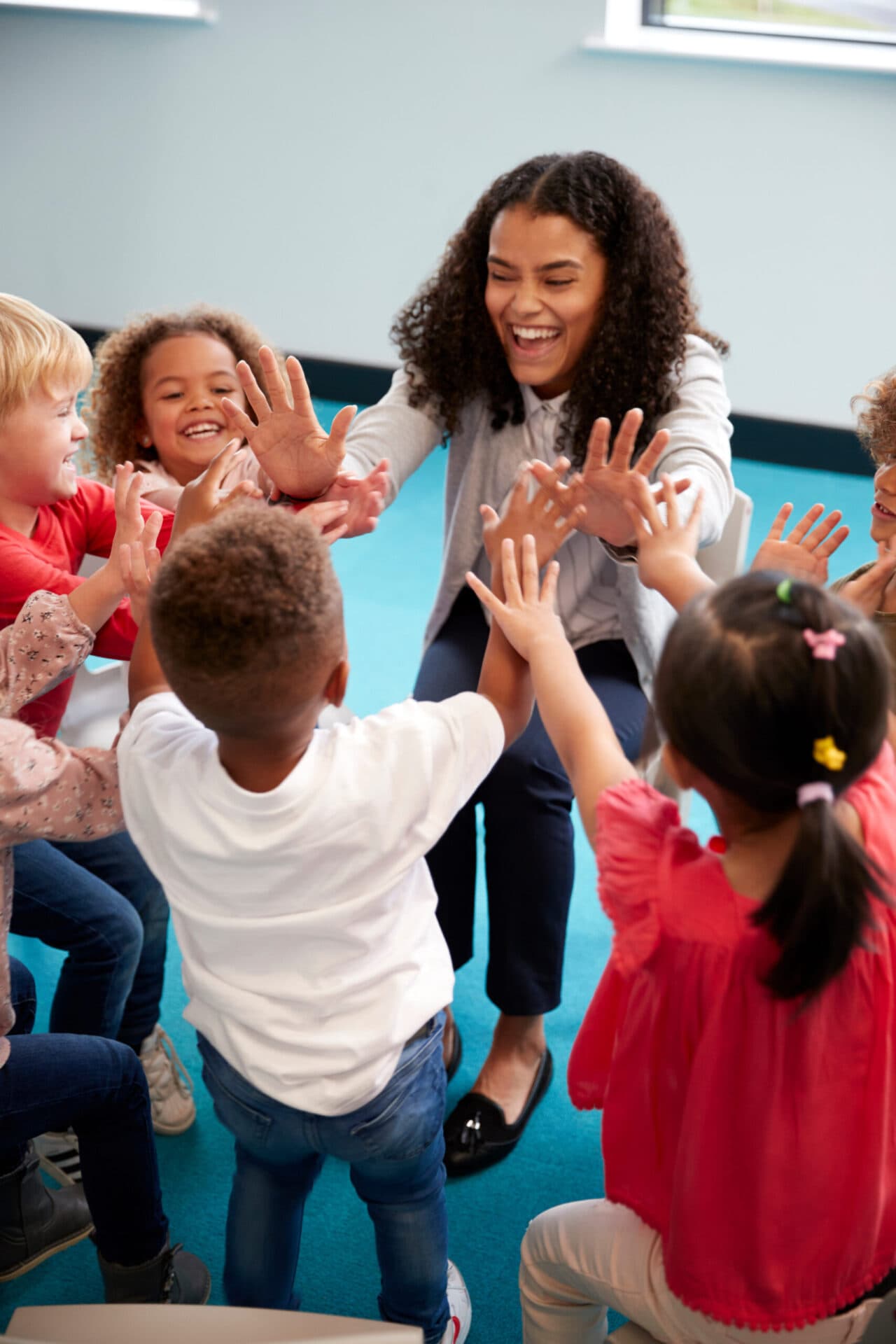 A Peyton’s Learning Place teacher reading with children